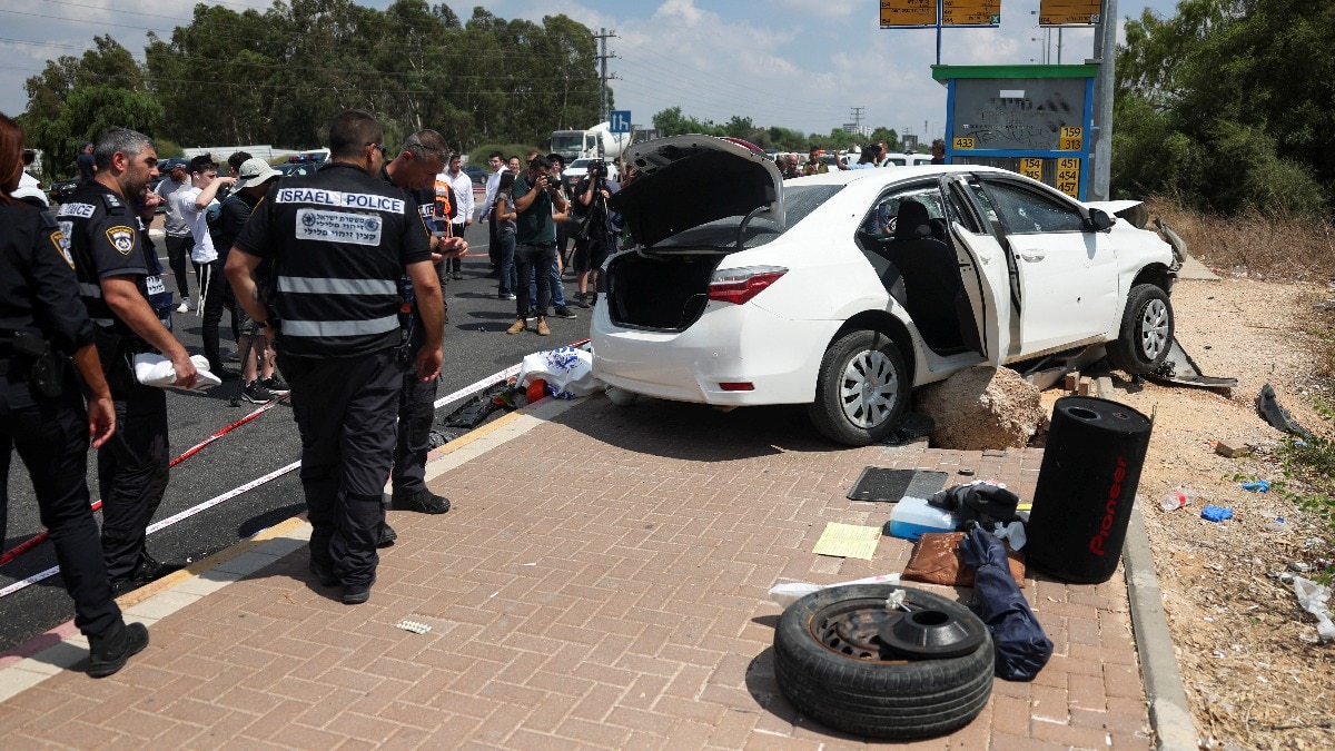 Four injured as man rams car into bus stop in central Israel