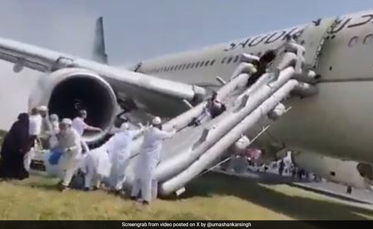 Fliers Slide Down Plane After Its Landing Gear Catches Fire In Pak