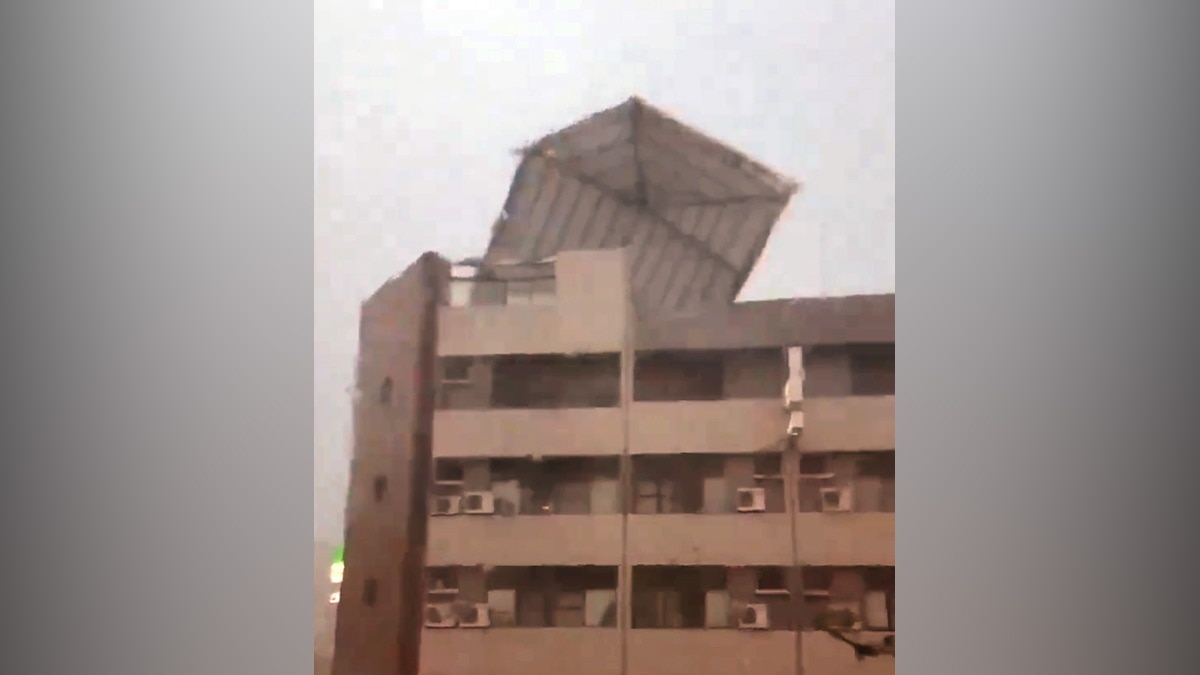 Typhoon Gaemi’s gusty winds push moving car backwards, rips off roof