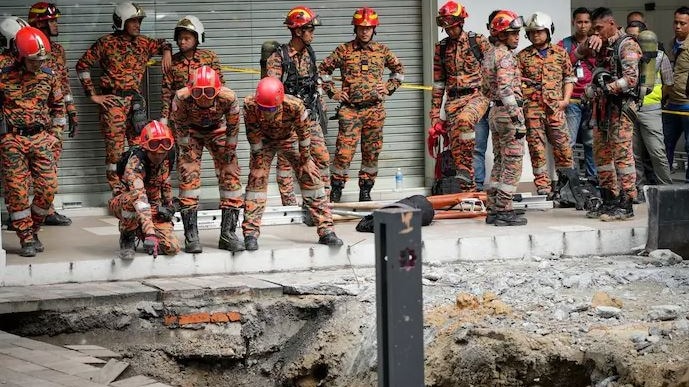 Indian woman’s family performs last rites at Malaysia sinkhole she fell into