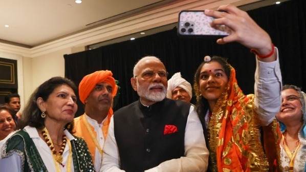 PM arrives in New York after Quad Summit, meets members of Indian community