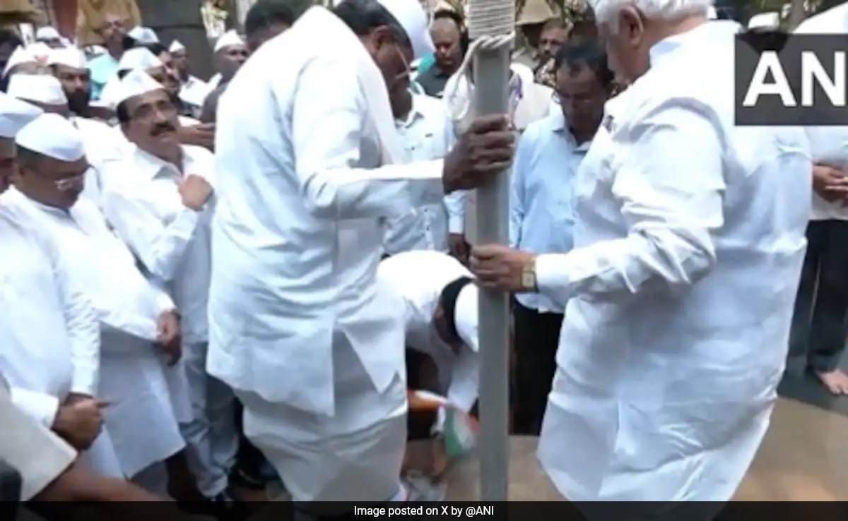 Outrage As Congress Man Takes Off Siddaramaiah's Shoes Holding Tricolour