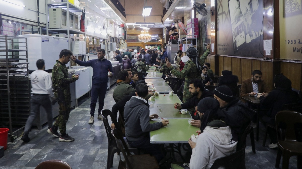 Syrians celebrate at iconic Damascus ice-cream parlour after Assad ouster