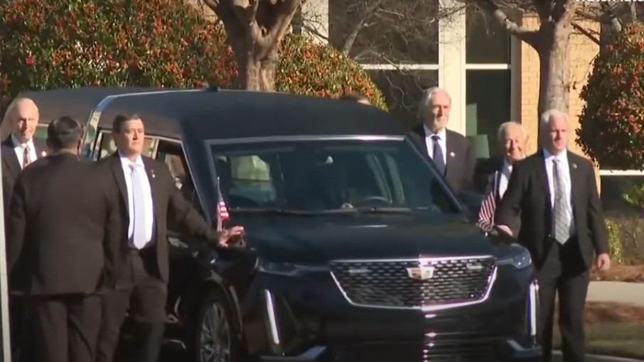 Jimmy Carter’s flag-draped casket is on its way to Atlanta as 39th president’s state funeral begins